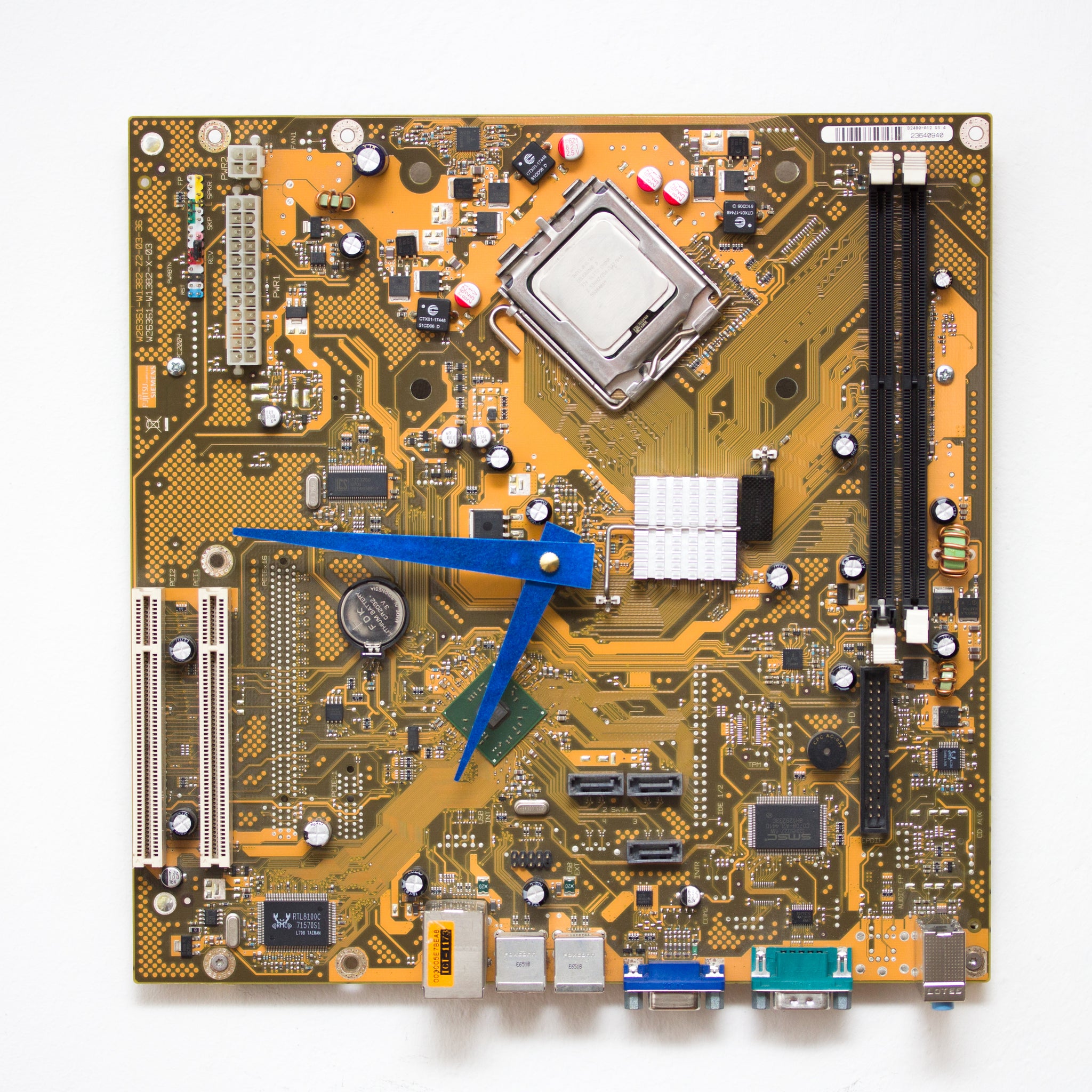 Techie Wall Clock made of yellow / olive green Circuit board